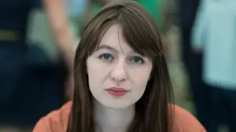 Irish author Sally Rooney claims she is unable to enter the UK due to arrest fears